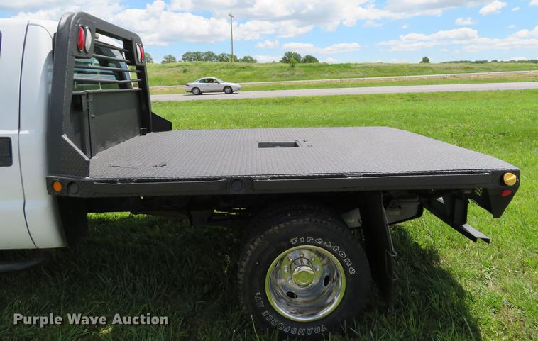 image for item DE8104 2011 Ford F350 Super Duty XL Crew Cab flatbed pickup truck