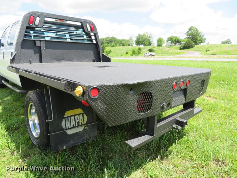 image for item DE8104 2011 Ford F350 Super Duty XL Crew Cab flatbed pickup truck