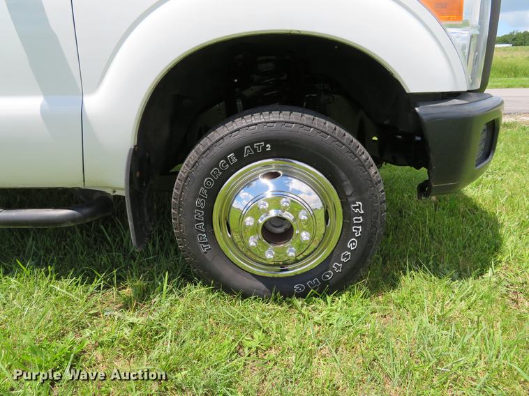 image for item DE8104 2011 Ford F350 Super Duty XL Crew Cab flatbed pickup truck