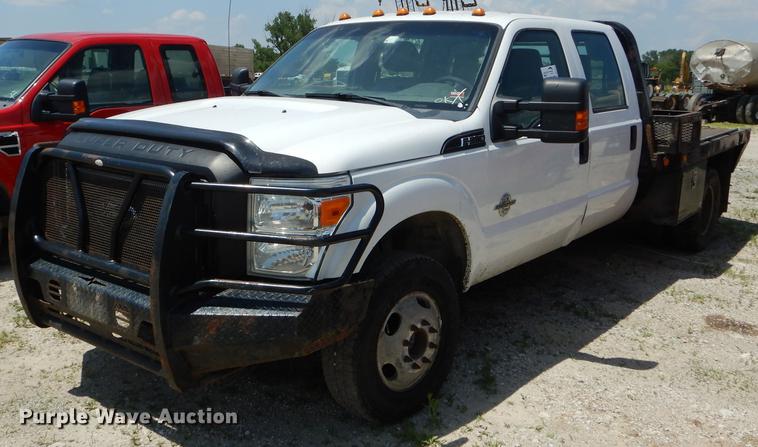 image for item DF7317 2011 Ford F350 Super Duty XL Crew Cab flatbed pickup truck