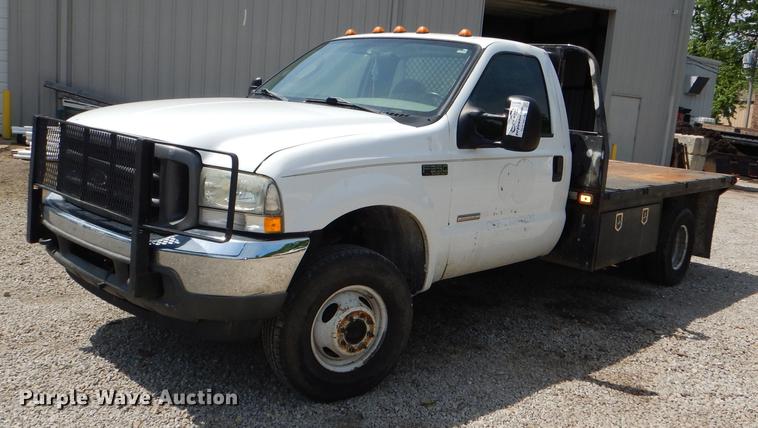 image for item DG1117 2004 Ford F350 Super Duty XL flatbed pickup truck