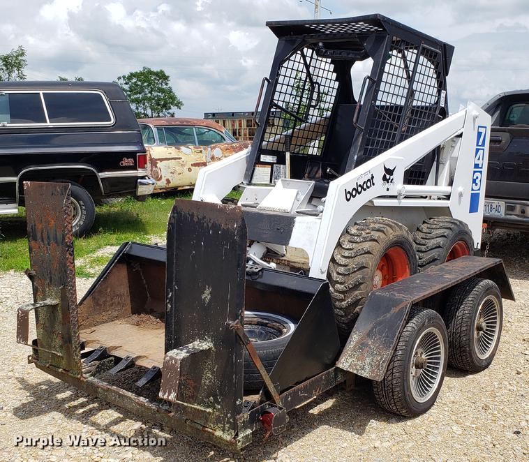 image for item EU9848 1985 Bobcat 743 skid steer with trailer