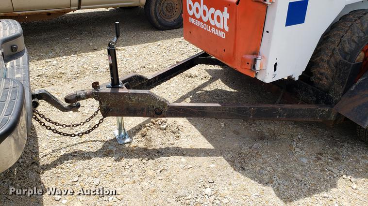 image for item EU9848 1985 Bobcat 743 skid steer with trailer