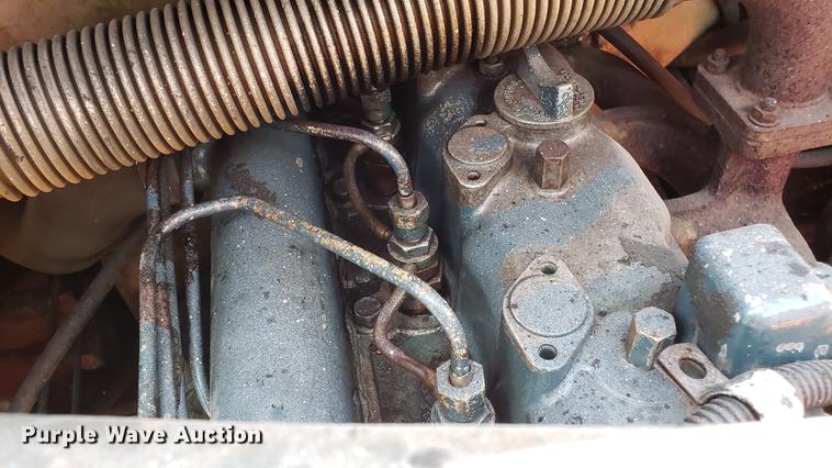 image for item EU9848 1985 Bobcat 743 skid steer with trailer