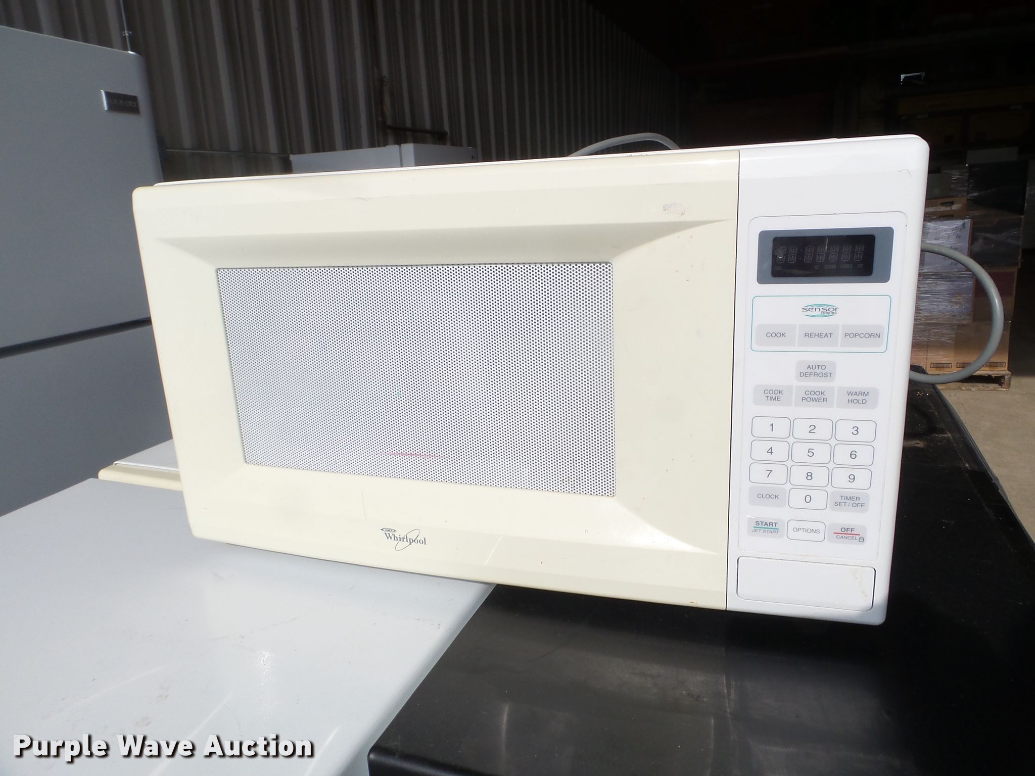 (20) Whirlpool microwaves in Des Moines, IA Item FM9395 sold Purple