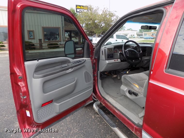 image for item DE7729 2002 Ford F250 Super Duty XLT Crew Cab flatbed pickup truck