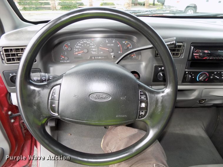 image for item DE7729 2002 Ford F250 Super Duty XLT Crew Cab flatbed pickup truck