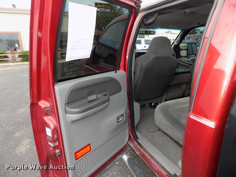 image for item DE7729 2002 Ford F250 Super Duty XLT Crew Cab flatbed pickup truck