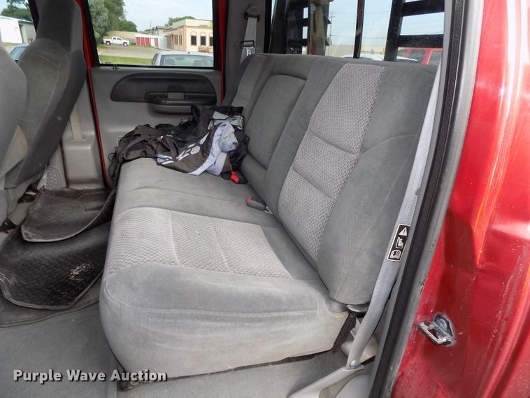 image for item DE7729 2002 Ford F250 Super Duty XLT Crew Cab flatbed pickup truck