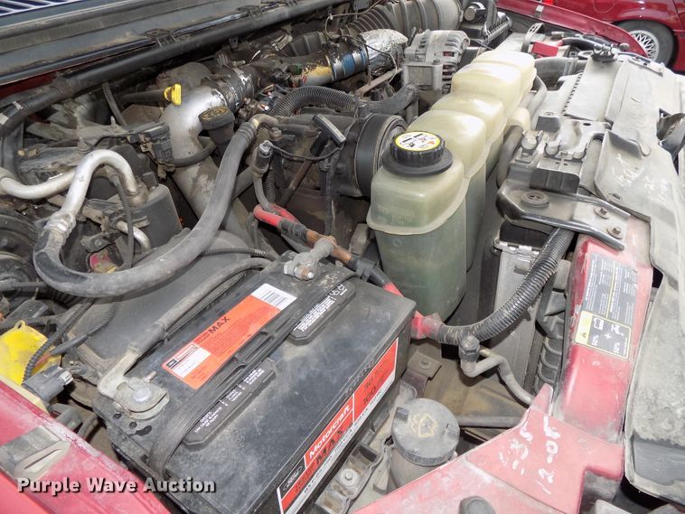 image for item DE7729 2002 Ford F250 Super Duty XLT Crew Cab flatbed pickup truck