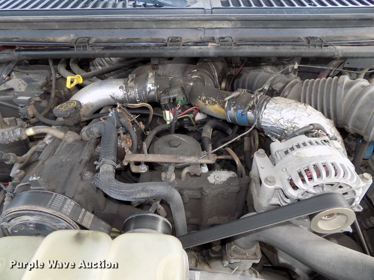 image for item DE7729 2002 Ford F250 Super Duty XLT Crew Cab flatbed pickup truck