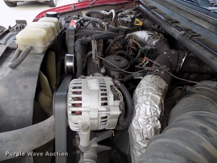 image for item DE7729 2002 Ford F250 Super Duty XLT Crew Cab flatbed pickup truck