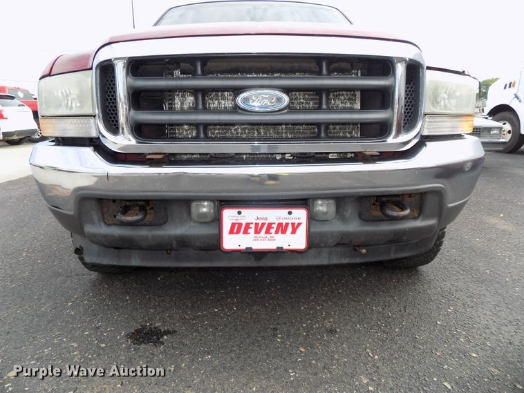 image for item DE7729 2002 Ford F250 Super Duty XLT Crew Cab flatbed pickup truck