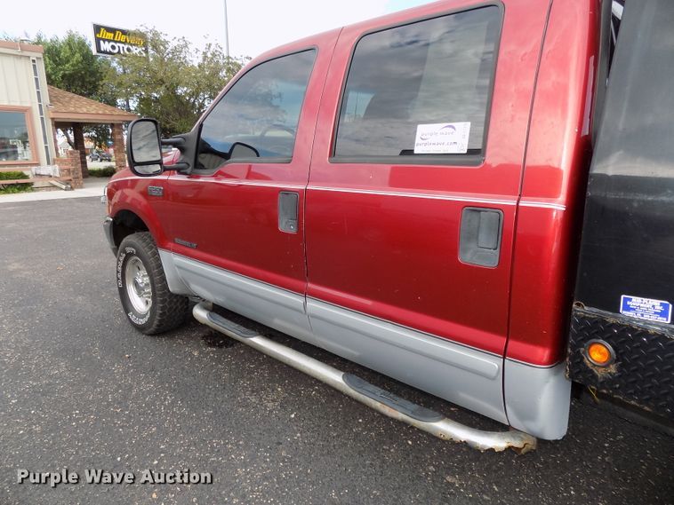 image for item DE7729 2002 Ford F250 Super Duty XLT Crew Cab flatbed pickup truck