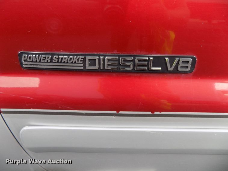 image for item DE7729 2002 Ford F250 Super Duty XLT Crew Cab flatbed pickup truck