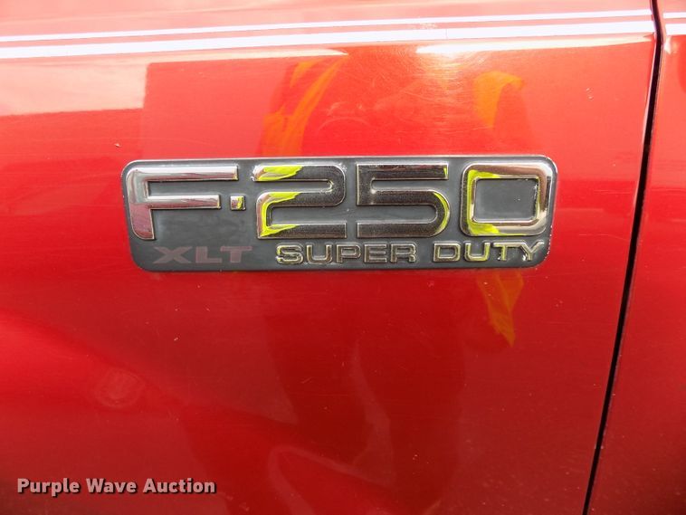 image for item DE7729 2002 Ford F250 Super Duty XLT Crew Cab flatbed pickup truck