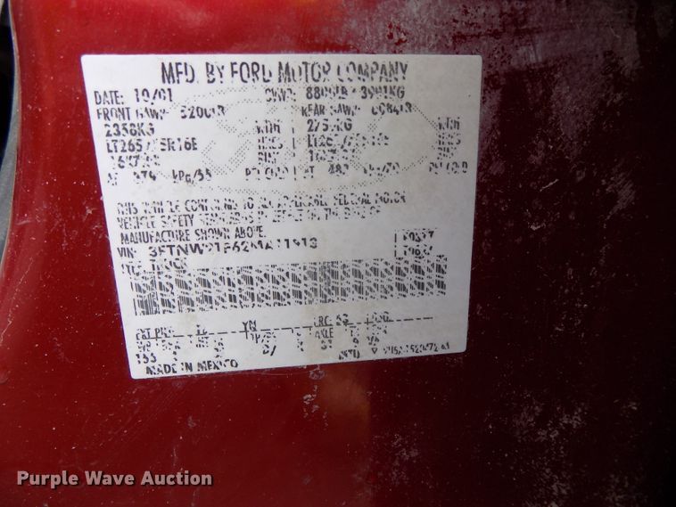 image for item DE7729 2002 Ford F250 Super Duty XLT Crew Cab flatbed pickup truck