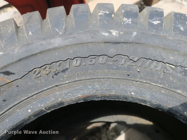 image for item EA9266 23x10.5-12 NHS tire and wheel