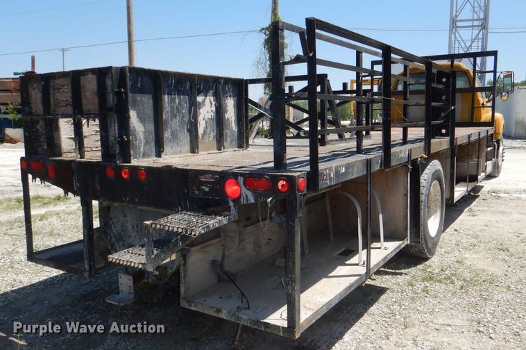 image for item DE3530 1997 GMC C7500 flatbed truck