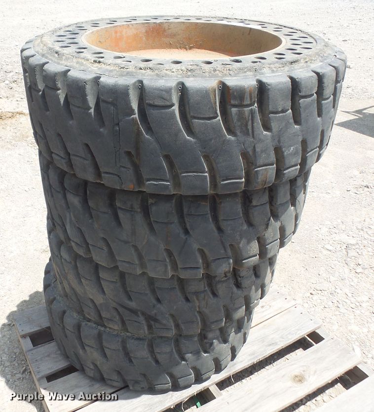 image for item FJ9152 (4) 12-16.5 solid skid steer tires and wheels