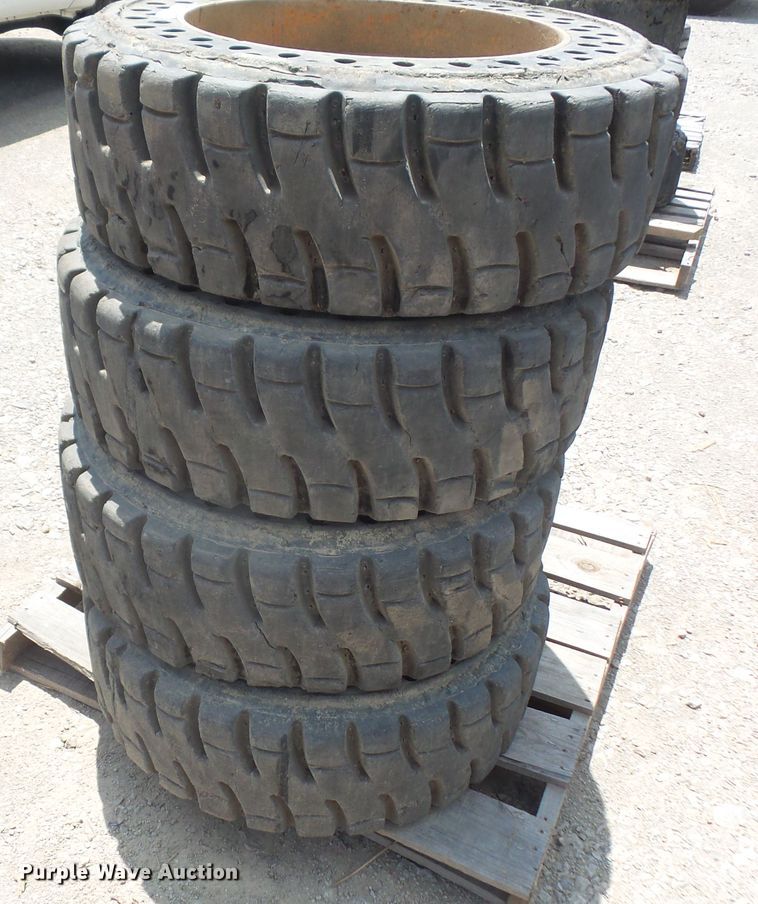 image for item FJ9152 (4) 12-16.5 solid skid steer tires and wheels