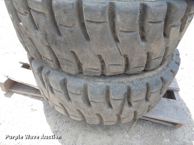 image for item FJ9152 (4) 12-16.5 solid skid steer tires and wheels