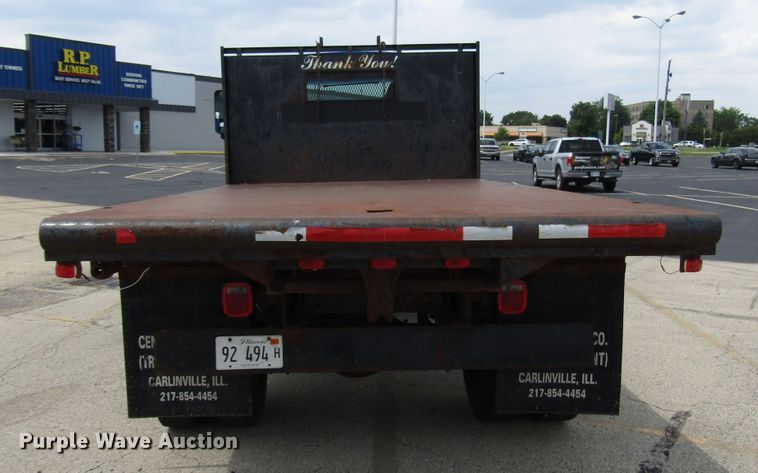 image for item DG1320 2003 GMC C7500 flat dump bed truck