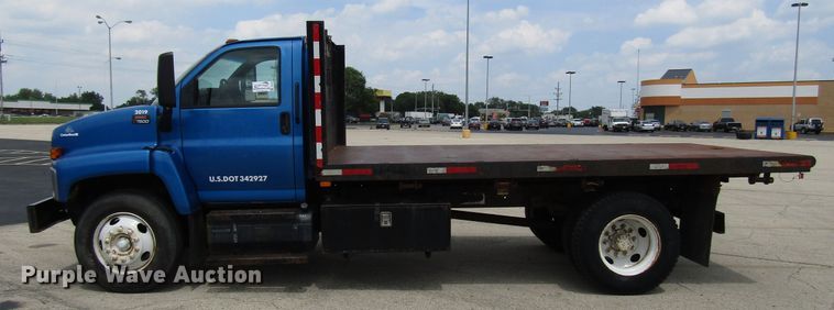 image for item DG1320 2003 GMC C7500 flat dump bed truck