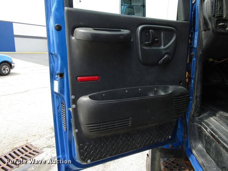image for item DG1320 2003 GMC C7500 flat dump bed truck