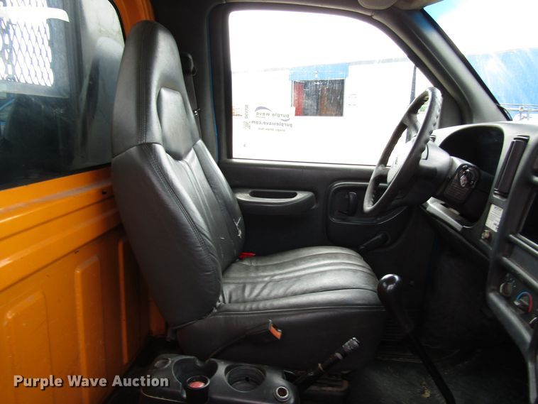 image for item DG1320 2003 GMC C7500 flat dump bed truck