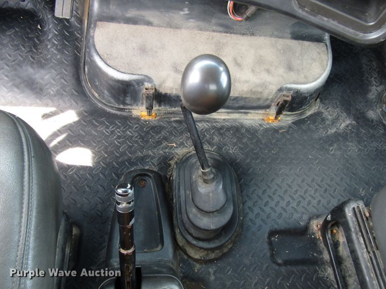 image for item DG1320 2003 GMC C7500 flat dump bed truck