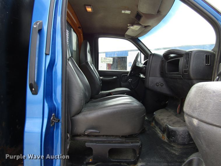 image for item DG1320 2003 GMC C7500 flat dump bed truck