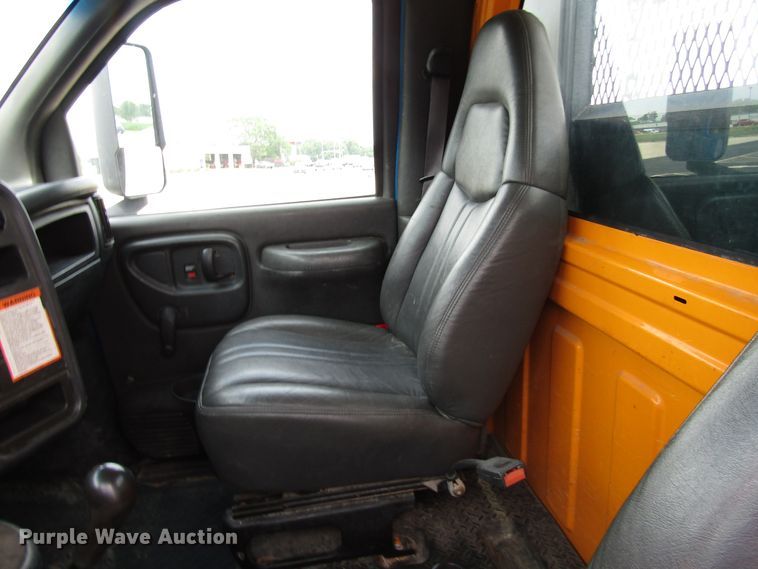 image for item DG1320 2003 GMC C7500 flat dump bed truck