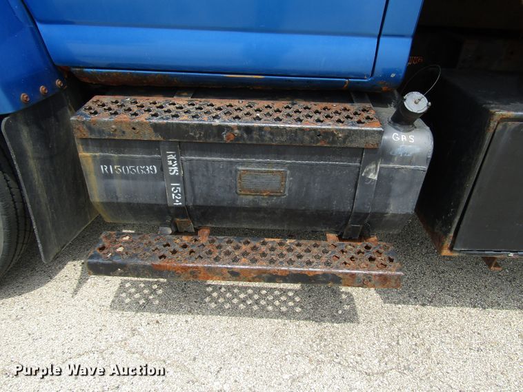 image for item DG1320 2003 GMC C7500 flat dump bed truck