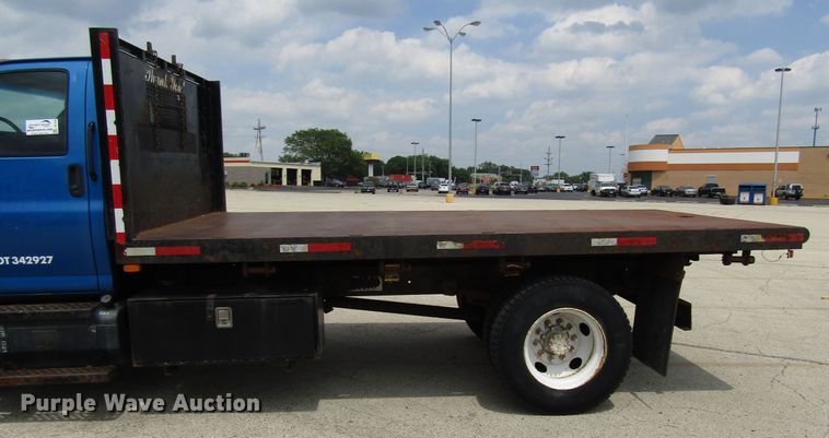 image for item DG1320 2003 GMC C7500 flat dump bed truck