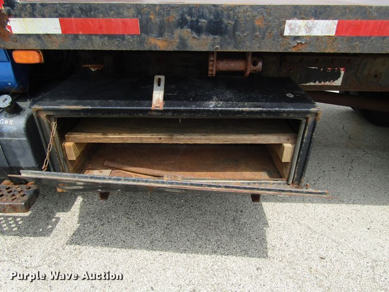 image for item DG1320 2003 GMC C7500 flat dump bed truck