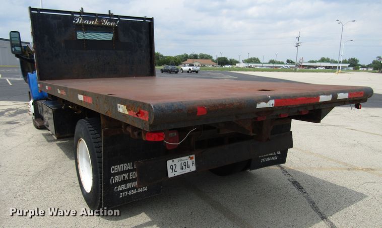 image for item DG1320 2003 GMC C7500 flat dump bed truck