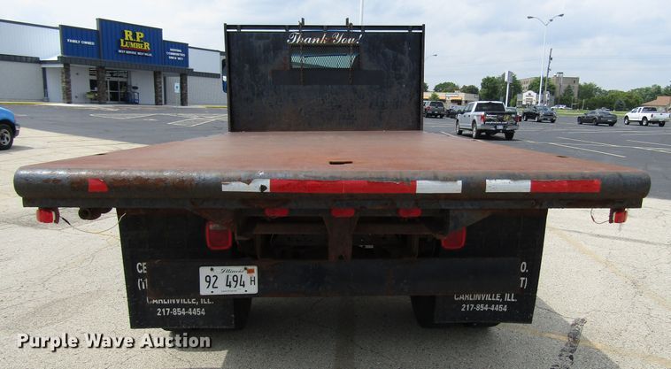 image for item DG1320 2003 GMC C7500 flat dump bed truck