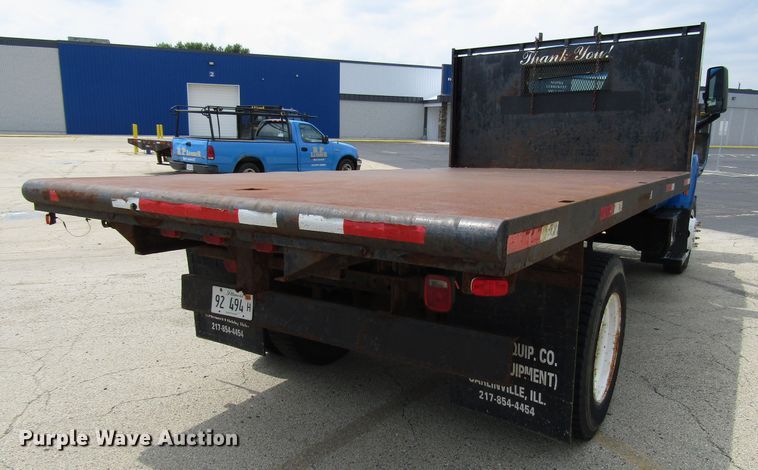 image for item DG1320 2003 GMC C7500 flat dump bed truck