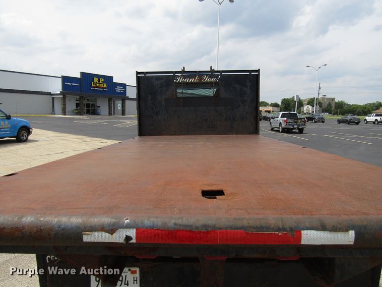 image for item DG1320 2003 GMC C7500 flat dump bed truck