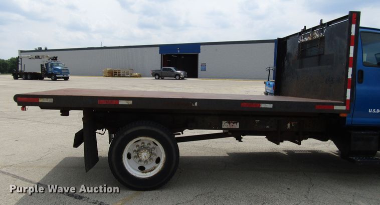 image for item DG1320 2003 GMC C7500 flat dump bed truck