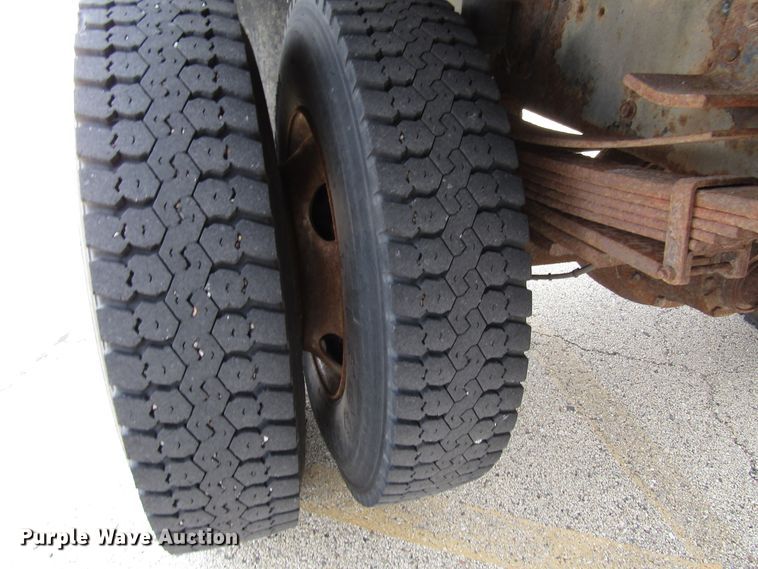 image for item DG1320 2003 GMC C7500 flat dump bed truck