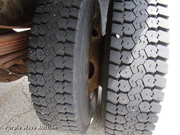 image for item DG1320 2003 GMC C7500 flat dump bed truck