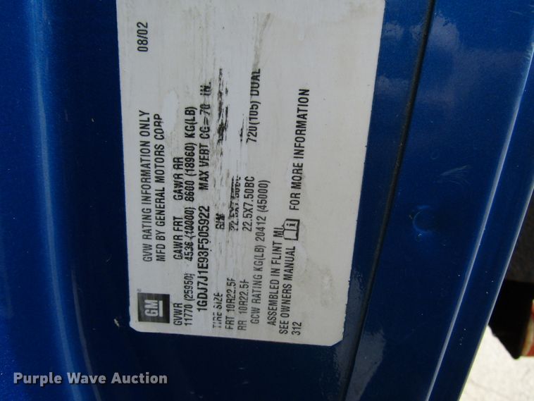 image for item DG1320 2003 GMC C7500 flat dump bed truck