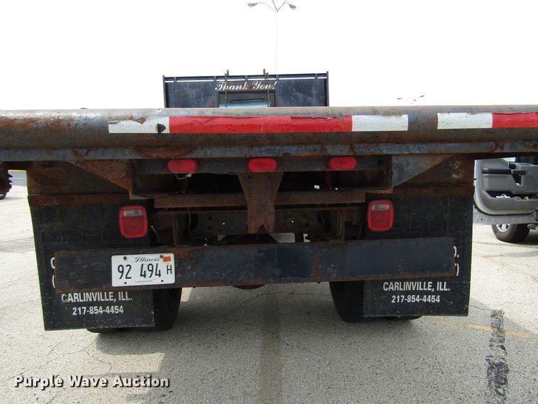 image for item DG1320 2003 GMC C7500 flat dump bed truck