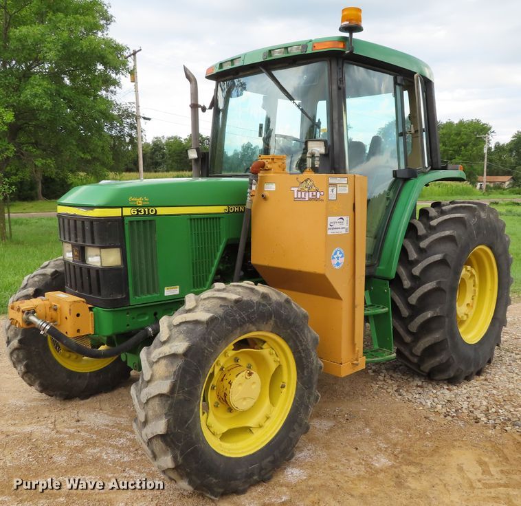 image for item DD6313 2000 John Deere 6310 MFWD tractor