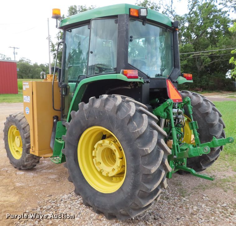 image for item DD6313 2000 John Deere 6310 MFWD tractor