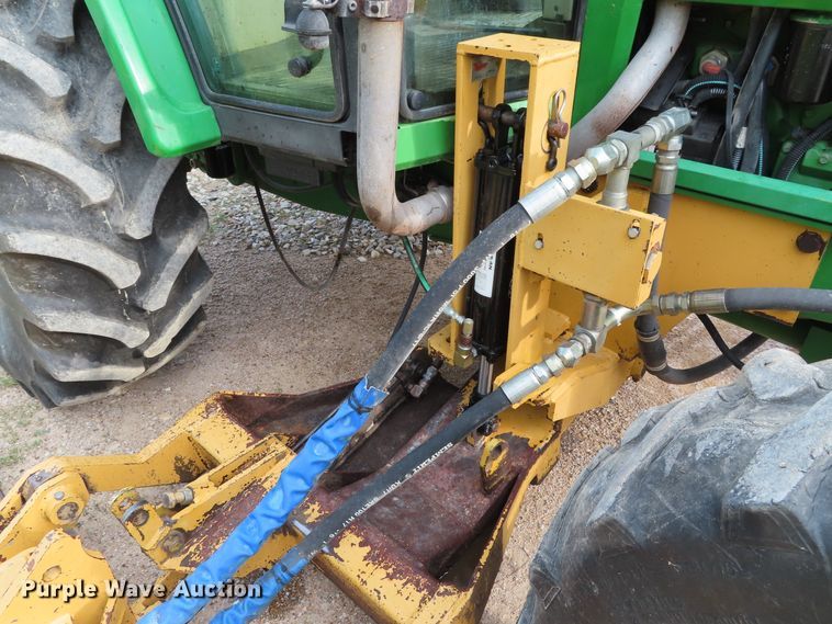 image for item DD6313 2000 John Deere 6310 MFWD tractor