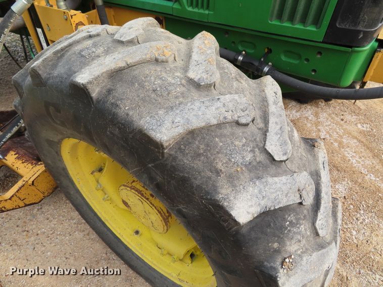 image for item DD6313 2000 John Deere 6310 MFWD tractor