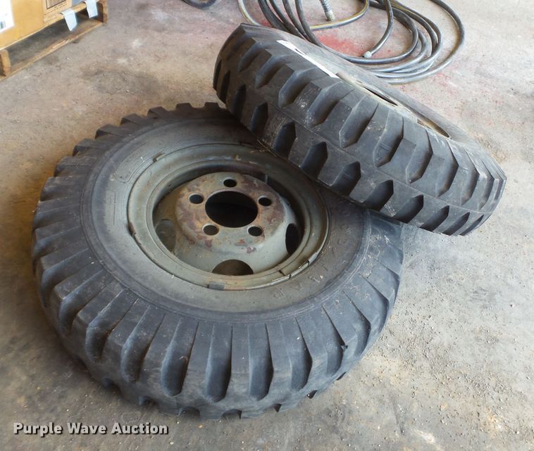 image for item DE7910 (2) 9.00-16 tires and wheels